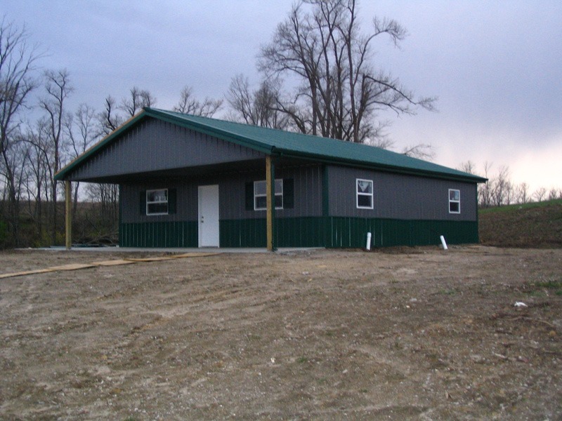 pole built metal workshop with porch overhang barn style pole